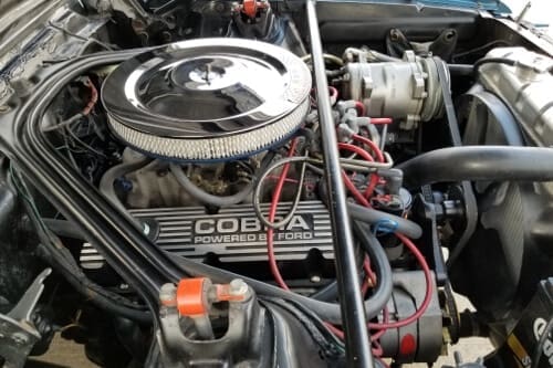 Your Guide on Proper Muscle Car Maintenance; image of a Ford Cobra performance motor in for service at Accelerate Auto Repair in Rowlett Tx
