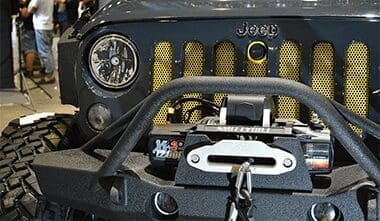 Jeep grill with attached wench on the front
