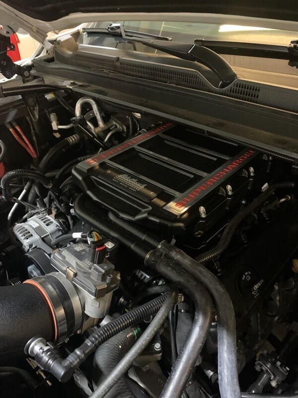 image of supercharger installation on vehicle at Accelerate Auto Repair in Rowlett Tx.